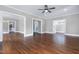 Open-concept living room featuring hardwood floors and neutral paint at 221 Charlotte Ave, Sanford, NC 27330