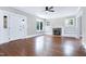 Bright living room with hardwood floors and a fireplace with built-in shelving at 221 Charlotte Ave, Sanford, NC 27330