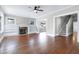 Spacious living room with hardwood floors, fireplace, and a staircase at 221 Charlotte Ave, Sanford, NC 27330