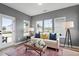 Cozy sunroom featuring ample windows, comfortable seating, and stylish decor at 225 Savannah Moss Way # 120, Raleigh, NC 27603