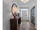 Stylish entryway featuring shiplap walls, a wooden console table, and modern decor at 232 Augusta Pond Way # 124, Raleigh, NC 27603