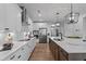 Well-appointed kitchen featuring white cabinets, stainless steel appliances, and a central island with seating at 232 Augusta Pond Way # 124, Raleigh, NC 27603