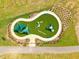 Aerial view of the playground with sunshades, benches, and climbing equipment at Georgia's Landing at 232 Augusta Pond Way # 124, Raleigh, NC 27603