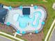 Aerial view of a resort-style pool with lounge chairs, umbrellas, and a unique design perfect for relaxation at 232 Augusta Pond Way # 124, Raleigh, NC 27603
