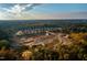 Expansive aerial view of a new home community amid a beautiful landscape with lush trees at 2328 Eagle Shot Ct # 18, Fuquay Varina, NC 27526