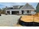 New construction home featuring a two-car garage and classic architectural details at 2328 Eagle Shot Ct # 18, Fuquay Varina, NC 27526