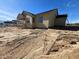 New construction home with a covered back porch and a light yellow exterior at 2328 Eagle Shot Ct # 18, Fuquay Varina, NC 27526