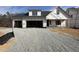 New construction home featuring a two-car garage and classic architectural details at 2328 Eagle Shot Ct # 18, Fuquay Varina, NC 27526