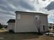 View of the side of the house with vinyl siding, a fenced yard, and a patio area at 271 Mayors Lane Ln, Wendell, NC 27591