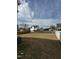 Expansive backyard with full perimeter fencing and neighborhood views beyond at 271 Mayors Lane Ln, Wendell, NC 27591