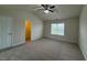 Spacious bedroom featuring neutral carpet and a ceiling fan, complemented by natural light from a window at 271 Mayors Lane Ln, Wendell, NC 27591