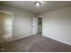 View of the bedroom with neutral carpet, featuring an open closet and a partially closed white door at 271 Mayors Lane Ln, Wendell, NC 27591