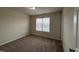 Cozy bedroom featuring neutral carpet and a window, creating a bright and inviting atmosphere at 271 Mayors Lane Ln, Wendell, NC 27591