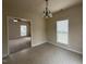 Cozy dining area featuring neutral walls, tile floors, and a modern chandelier at 271 Mayors Lane Ln, Wendell, NC 27591