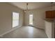 Open dining area featuring tile floors, a modern light fixture, and backyard access at 271 Mayors Lane Ln, Wendell, NC 27591
