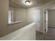 Neutral-colored hallway with doors leading to bedrooms with neutral carpet at 271 Mayors Lane Ln, Wendell, NC 27591