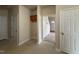 Hallway has three doorways and shows ceramic tile, and a cabinet above a laundry area at 271 Mayors Lane Ln, Wendell, NC 27591