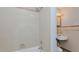 Bathroom featuring a tiled shower, and a pedestal sink at 2720 Amherst Ave, Burlington, NC 27215