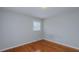 Cozy bedroom with hardwood floors, neutral paint and light coming through the window at 2720 Amherst Ave, Burlington, NC 27215