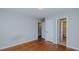 Bedroom with hardwood floors and access to the en-suite bathroom and walk-in closet at 2720 Amherst Ave, Burlington, NC 27215
