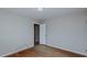 A bedroom features hardwood floors and neutral-painted walls at 2720 Amherst Ave, Burlington, NC 27215