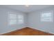 Cozy bedroom with hardwood floors, natural light from the windows and neutral paint at 2720 Amherst Ave, Burlington, NC 27215