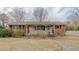 Charming brick home with a cozy front porch and well-maintained yard at 2720 Amherst Ave, Burlington, NC 27215