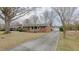 Ranch house with a detached garage and long driveway at 2720 Amherst Ave, Burlington, NC 27215
