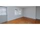 Bright living room with hardwood floors, a large window, and neutral paint at 2720 Amherst Ave, Burlington, NC 27215
