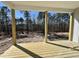 View from the back porch overlooking a wooded area at 394 Duncan Creek Rd # 158, Lillington, NC 27546