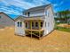 Backyard view of house showcasing new deck at 394 Duncan Creek Rd # 158, Lillington, NC 27546