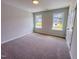 Cozy bedroom with two windows bringing in natural light, creating a warm ambiance at 394 Duncan Creek Rd # 158, Lillington, NC 27546