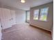 Comfortable bedroom with closet and a pair of bright windows at 394 Duncan Creek Rd # 158, Lillington, NC 27546
