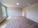 Spacious bedroom featuring neutral tones, carpet and window, ready for personalization at 394 Duncan Creek Rd # 158, Lillington, NC 27546