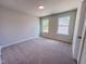 Inviting bedroom featuring neutral paint and dual windows, creating a serene atmosphere at 394 Duncan Creek Rd # 158, Lillington, NC 27546