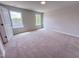 Bright bedroom with natural light, featuring carpet and neutral walls at 394 Duncan Creek Rd # 158, Lillington, NC 27546