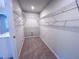 Walk-in closet with installed shelving at 394 Duncan Creek Rd # 158, Lillington, NC 27546