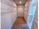 Walk-in closet with carpet flooring and metal shelving at 394 Duncan Creek Rd # 158, Lillington, NC 27546