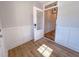 The entryway features decorative molding, wood floors, and a view into the hallway at 394 Duncan Creek Rd # 158, Lillington, NC 27546