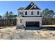 New construction two-story home with blue and gray siding and an attached two-car garage at 394 Duncan Creek Rd # 158, Lillington, NC 27546