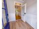 The foyer features wood floors and a view of the staircase and spacious living area at 394 Duncan Creek Rd # 158, Lillington, NC 27546