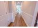 Hallway with wainscotting leads to the staircase and living area at 394 Duncan Creek Rd # 158, Lillington, NC 27546