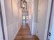 Hallway with wood floors, decorative molding, and modern lighting at 394 Duncan Creek Rd # 158, Lillington, NC 27546