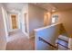 Second floor hallway with carpet and multiple doors leading to various rooms, with great lighting throughout at 394 Duncan Creek Rd # 158, Lillington, NC 27546
