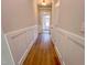 Hallway with board and batten accent wall and hardwood flooring at 394 Duncan Creek Rd # 158, Lillington, NC 27546