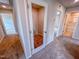 Hallway with doors leading to bedrooms and bathrooms, featuring plush carpeting at 394 Duncan Creek Rd # 158, Lillington, NC 27546