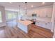 Modern kitchen with an island, stainless steel appliances, and stylish pendant lighting at 394 Duncan Creek Rd # 158, Lillington, NC 27546