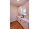 Bright kitchenette features white cabinetry, quartz countertops, subway tile backsplash, modern faucet and a window for natural light at 394 Duncan Creek Rd # 158, Lillington, NC 27546