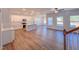 Spacious open-concept living room with wood floors that flows into the kitchen at 394 Duncan Creek Rd # 158, Lillington, NC 27546