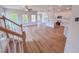 Open-concept living area flows from kitchen with many windows and modern ceiling fan at 394 Duncan Creek Rd # 158, Lillington, NC 27546